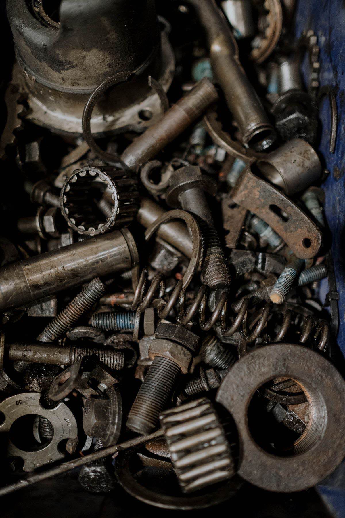 Bearings, gears and spare parts in a workshop tray